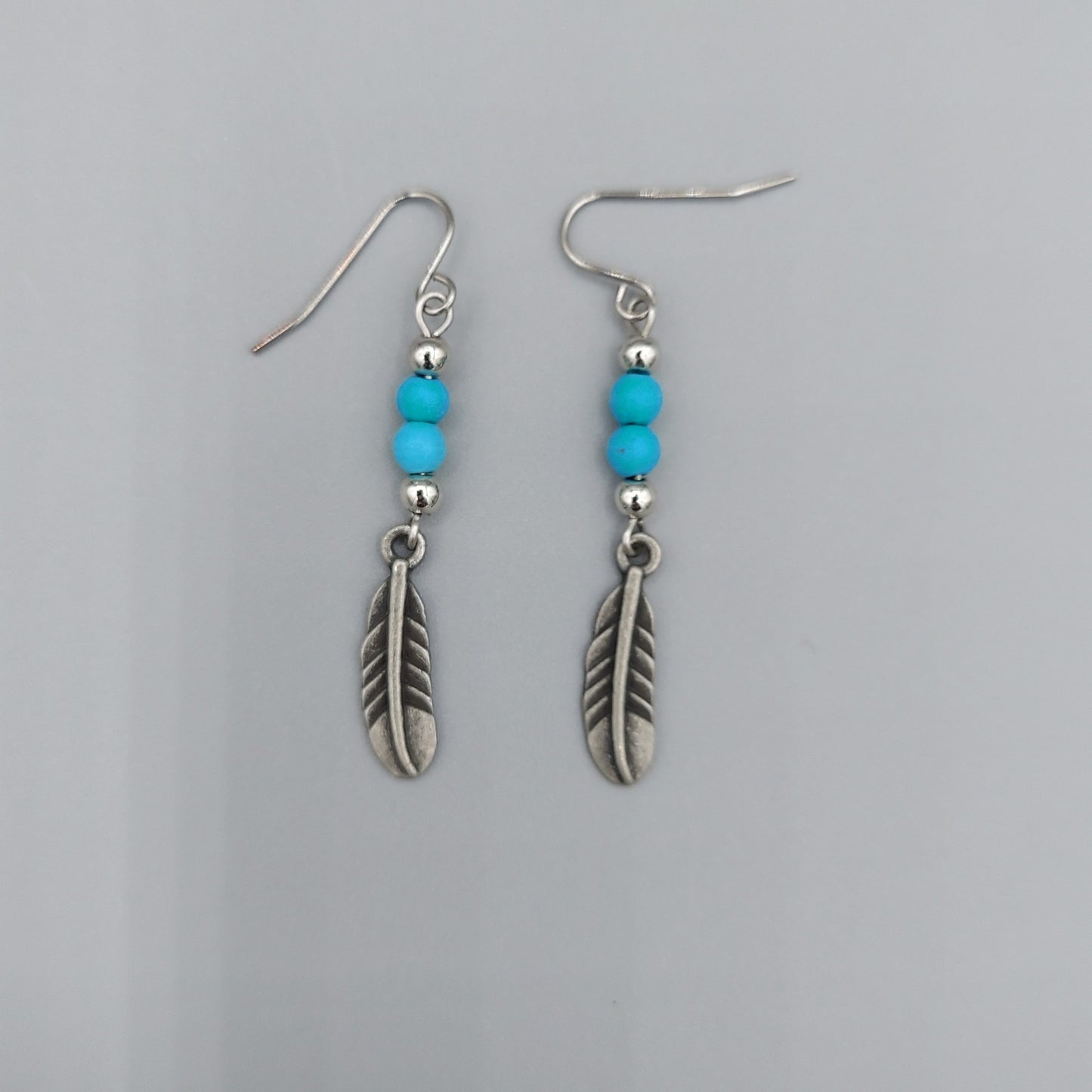 Pewter Feather Earrings/Turquoise Howlite