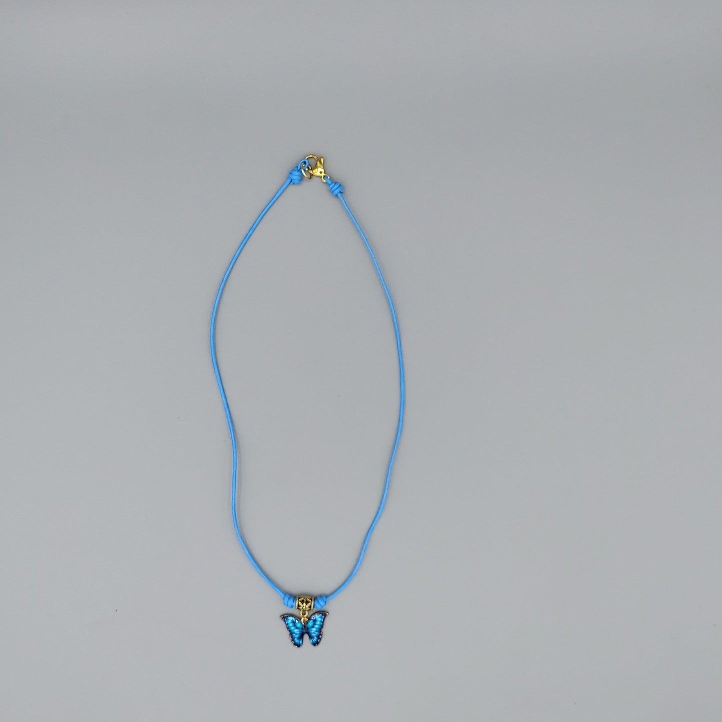 Blue Butterfly Necklace on Leather Cord