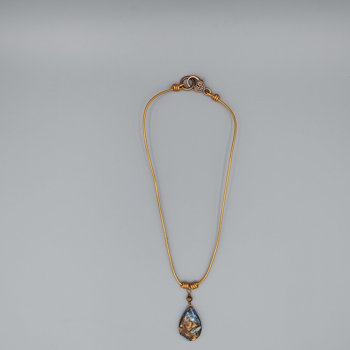 Blue Impression Jasper on Gold Leather
