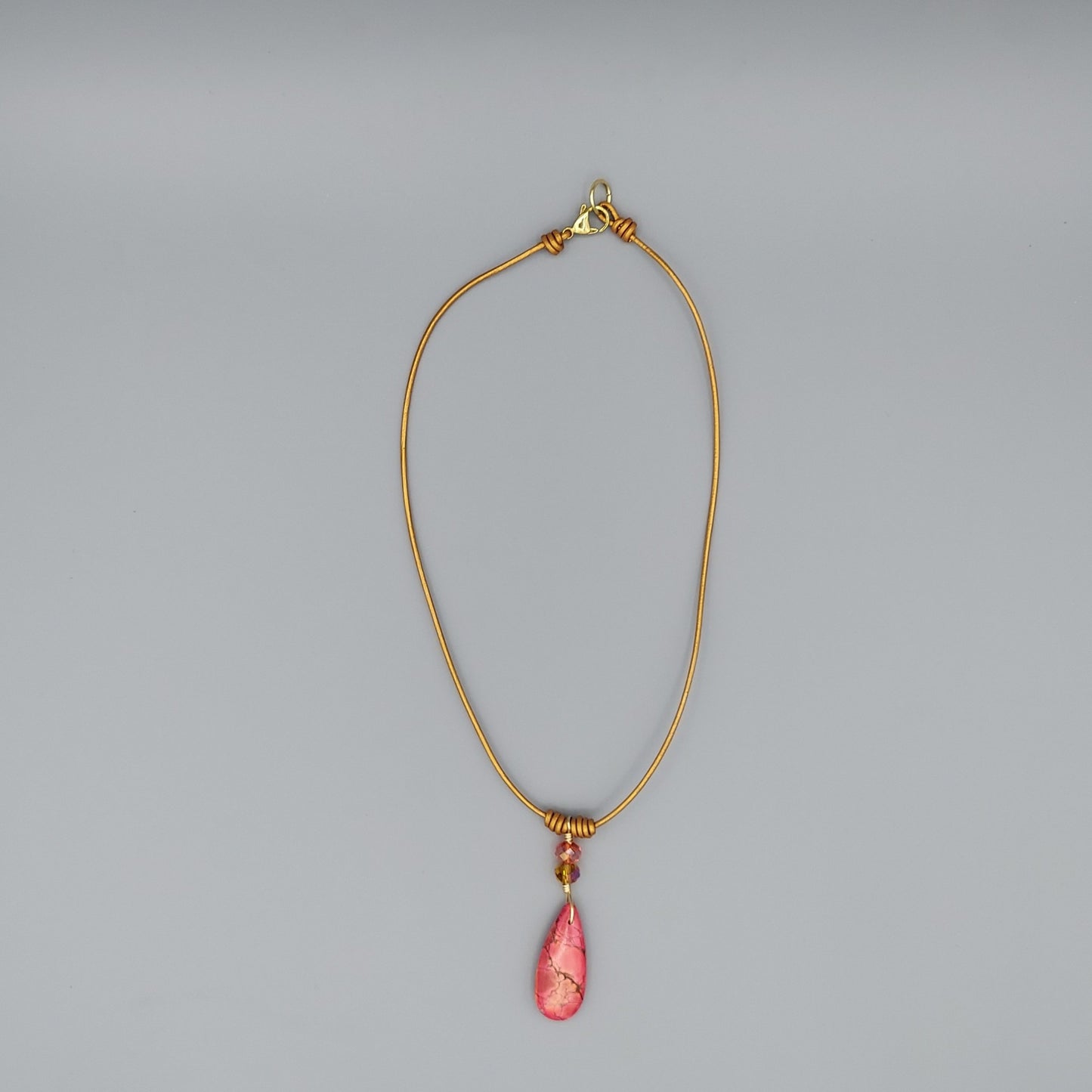 Ruby Impression Jasper Teardrop on Gold Leather