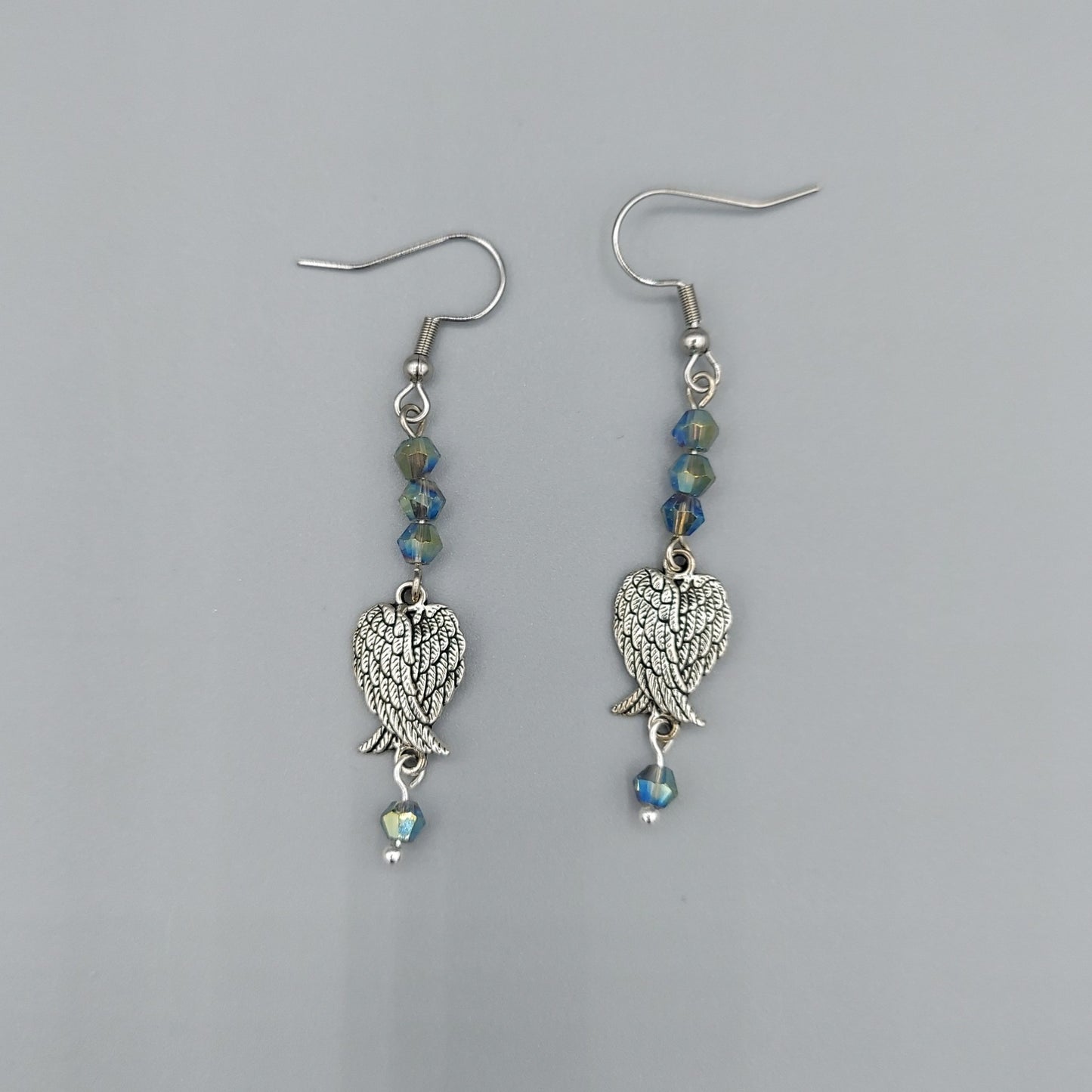 Crossed Wing Earrings/Blue Iris Crystals