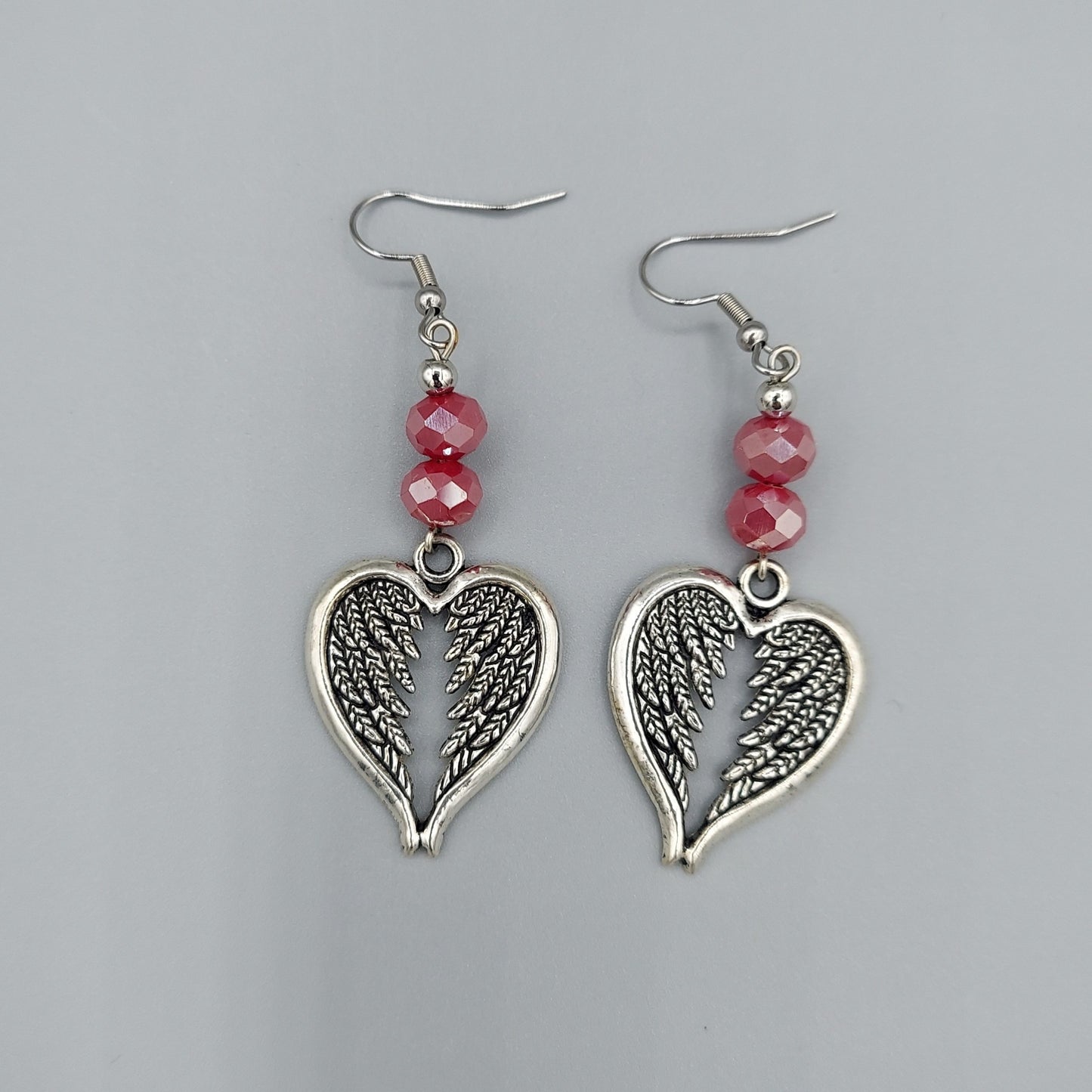 Silver Heart Wing Earrings/Red Crystals